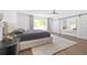 Bright main bedroom with large windows, stylish ceiling fan, and inviting window seat at 639 W Ponce De Leon Ave, Decatur, GA 30030