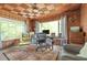 Stylish home office with paneled walls, unique ceiling, and scenic views at 639 W Ponce De Leon Ave, Decatur, GA 30030