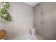 Modern walk-in shower featuring sleek gray tile and a contemporary fixture at 639 W Ponce De Leon Ave, Decatur, GA 30030