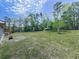 Expansive backyard with lush lawn and mature trees at 72 Hazelwood Nw Rd, Cartersville, GA 30121