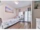 Bright bedroom with a single bed, white walls, and wood-look floors at 72 Hazelwood Nw Rd, Cartersville, GA 30121