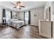 Comfortable bedroom with ceiling fan, mirror, and wood-look flooring at 72 Hazelwood Nw Rd, Cartersville, GA 30121