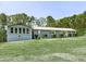 Charming home featuring well-manicured landscaping and a screened porch at 72 Hazelwood Nw Rd, Cartersville, GA 30121
