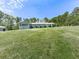 Attractive home with a sunroom and a spacious, green front yard at 72 Hazelwood Nw Rd, Cartersville, GA 30121