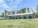 Charming house with sunroom, manicured shrubs, and expansive grassy lawn at 72 Hazelwood Nw Rd, Cartersville, GA 30121