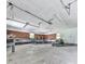 Spacious garage with ample workspace, shelving, and lawn equipment parking at 72 Hazelwood Nw Rd, Cartersville, GA 30121