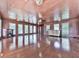 Expansive sunroom featuring hardwood floors, wood paneling, fireplace, and plenty of natural light at 72 Hazelwood Nw Rd, Cartersville, GA 30121