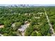 Stunning aerial view of the property showcasing lush greenery and the city skyline in the distance at 863 Commonwealth Se Ave, Atlanta, GA 30312