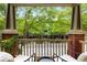 Scenic view from the covered balcony, showcasing lush greenery and neighborhood at 863 Commonwealth Se Ave, Atlanta, GA 30312