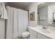 Clean bathroom with white fixtures, vanity, and shower with curtain at 863 Commonwealth Se Ave, Atlanta, GA 30312