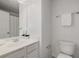This is a powder room featuring a toilet, sink and a mirror at 863 Commonwealth Se Ave, Atlanta, GA 30312