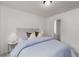 This bright bedroom features neutral decor and an ensuite bathroom at 863 Commonwealth Se Ave, Atlanta, GA 30312