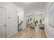 Inviting entryway with hardwood floors, elegant molding, and a view of the living room at 863 Commonwealth Se Ave, Atlanta, GA 30312