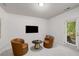 Living room is decorated with accent chairs and features outdoor access and natural light at 863 Commonwealth Se Ave, Atlanta, GA 30312