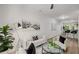 Bright living room with light colored hardwood floors, modern furnishings, and decorative art at 863 Commonwealth Se Ave, Atlanta, GA 30312
