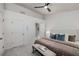 A neutral colored main bedroom features a doorway to the bathroom and a seating bench at 863 Commonwealth Se Ave, Atlanta, GA 30312