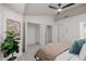 Bright main bedroom features neutral decor, ceiling fan, and walk-in closets at 863 Commonwealth Se Ave, Atlanta, GA 30312