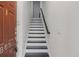 Entryway staircase with freshly painted white risers, black treads, and a sleek handrail at 863 Commonwealth Se Ave, Atlanta, GA 30312
