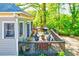 Spacious wood deck with dining area, grill, and a blue trim door for outdoor relaxation at 1426 Memorial Se Dr, Atlanta, GA 30317