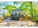 Charming home features a backyard with a deck and outdoor dining area at 1426 Memorial Se Dr, Atlanta, GA 30317