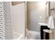 Bathroom features tiled floors, patterned shower curtain, vanity sink and natural light at 1426 Memorial Se Dr, Atlanta, GA 30317