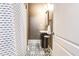 Charming bathroom features tiled floors, patterned shower curtain, vanity sink and natural light at 1426 Memorial Se Dr, Atlanta, GA 30317