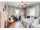 Spacious bedroom with a red brick fireplace, exercise bike, and large windows at 1426 Memorial Se Dr, Atlanta, GA 30317