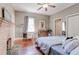 Bedroom features hardwood floors, a decorative fireplace, and soft natural light at 1426 Memorial Se Dr, Atlanta, GA 30317