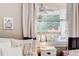 Bedroom featuring a large window with sheer curtains and a view of the outdoor deck at 1426 Memorial Se Dr, Atlanta, GA 30317