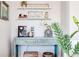 A charming coffee bar setup with rustic console, shelving, and decorative touches at 1426 Memorial Se Dr, Atlanta, GA 30317