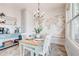 Charming dining room featuring a world map accent wall and stylish light fixture at 1426 Memorial Se Dr, Atlanta, GA 30317