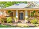 Inviting home with front porch, garden and walkway, and a beautifully landscaped yard at 1426 Memorial Se Dr, Atlanta, GA 30317