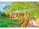 Charming home featuring a cozy front porch, manicured lawn, lush greenery, and inviting curb appeal at 1426 Memorial Se Dr, Atlanta, GA 30317