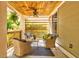 This cozy porch is perfect for entertaining with its outdoor seating, ceiling fan, and views of the yard at 1426 Memorial Se Dr, Atlanta, GA 30317