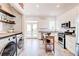 Modern kitchen includes stainless appliances, white cabinets, and a center island at 1426 Memorial Se Dr, Atlanta, GA 30317