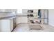 Clean kitchen with stainless steel appliances, granite countertops, and kitchen island at 1426 Memorial Se Dr, Atlanta, GA 30317
