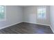 This bedroom features sun-filled windows and hardwood floors that create a warm atmosphere at 2046 Copperfield Cir, Decatur, GA 30035