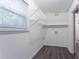 Walk-in closet featuring wood-look flooring and shelving at 2046 Copperfield Cir, Decatur, GA 30035