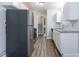 Modern kitchen featuring stainless steel appliances, granite countertops, subway tile backsplash and gray vinyl floors at 2046 Copperfield Cir, Decatur, GA 30035