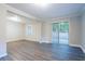 Open-concept living room featuring hardwood flooring and sliding glass doors to the outside at 2046 Copperfield Cir, Decatur, GA 30035