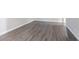 Spacious room featuring modern gray vinyl flooring and a neutral paint palette at 2046 Copperfield Cir, Decatur, GA 30035