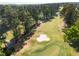 Aerial view showcasing the golf course with lush greenery, sand traps and tree-lined fairways at 2316 Echelon Ln, Smyrna, GA 30080