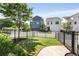 Fenced backyard featuring well-maintained lawn, concrete patio, and views of neighboring homes at 2316 Echelon Ln, Smyrna, GA 30080