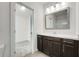 Modern bathroom with a single vanity, framed mirror, updated fixtures, and a door to the water closet at 2316 Echelon Ln, Smyrna, GA 30080