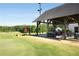 Golf course view with outdoor covered patio area for dining or relaxation at 2316 Echelon Ln, Smyrna, GA 30080