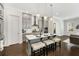 Bright kitchen featuring a large island, modern lighting, and stainless steel appliances at 2316 Echelon Ln, Smyrna, GA 30080