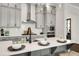 Close up shot of a large kitchen island with seating and modern fixtures at 2316 Echelon Ln, Smyrna, GA 30080