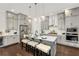 A modern kitchen with stainless steel appliances, gray cabinets, and a spacious island at 2316 Echelon Ln, Smyrna, GA 30080