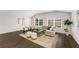 The living room has hardwood floors, neutral paint and decor, and a lot of natural light from the two windows at 2316 Echelon Ln, Smyrna, GA 30080