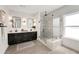 This main bathroom has dual sinks, framed mirrors, a gray tile floor, and a glass shower enclosure at 2316 Echelon Ln, Smyrna, GA 30080